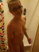 She's not naked, she's wearing glasses.