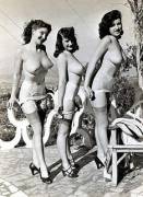 3 unknowns, topless, posing outside in garters & stockings. 40s/50s era?