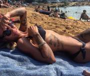 Fit, tattood girl in black bikini