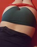 Pulling down her shorts