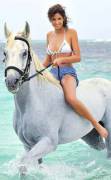 Miss France 2010 Malika Menard riding her horse on the beach (x-post /r/BeautyQueens)