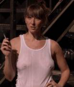 making her point by grabbing her boobs