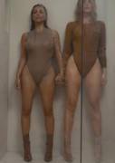 Kim and Khloe in bathing suits in a shower
