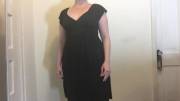 Her black dress hides her strap-on well