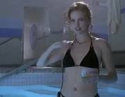 Charlize Theron removes her top