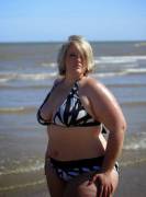 Curvy blonde on the beach