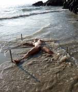 She found being staked in the sand to be a real tidal bore