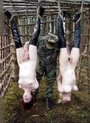 Misogynist GI posing with some captured Feminist POW cuntmeat trophies