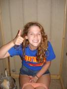 Cutie gives her thumbs up!