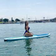 Jojo Levesque on a surfboard