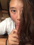 Beautiful eyed Asian sucking white dick