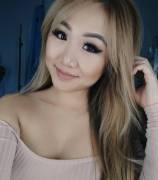 Shirt covers her arms but not hew shoulders