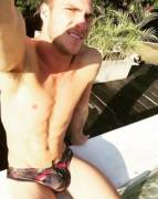 Poolside in his speedos