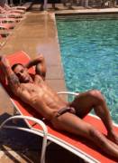 Laying in the sun naked