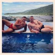 Two bros laying by the pool