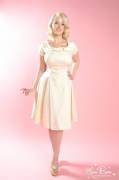 Demure beverly; full swing skirt; In a creamy vanilla, and anything but plain.