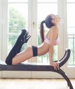 Jasmin doing yoga in socks and heels