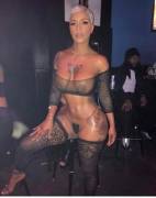 Her arms and legs are more covered than her pussy and tits