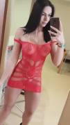 Teasing with her red sheer dress