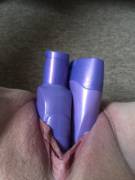 Two shampoo bottles shoved up her hungry cunt