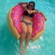 Gorgeous floating bikini babe