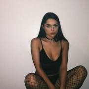 Fishnets seem to go well with chokers