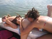 Blowing a raspberry on her friend.