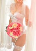 Bride hides her face but shows off a lot