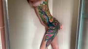 Tattooed babe alone in the shower