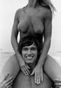 Arnold and a couple of boobs around 1973