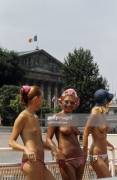 Topless at the pool Deligny with French National Assembly in the background, 1973