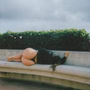 Lying on her side...