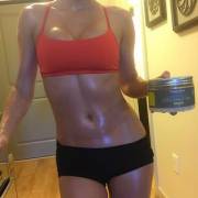 Sara's oily, glistening belly