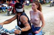 Topless on back of a motorcycle