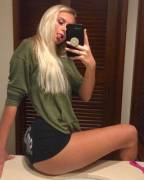 With her tongue out.