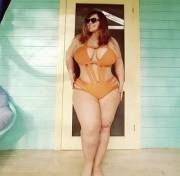 London Andrews showing off her curves in a one piece