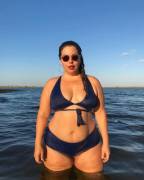 Wading in the ocean at sunset