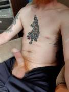 Sitting by the front window, hopefully giving the neighbours a show.