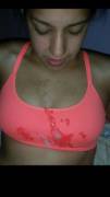 On her pink sports bra
