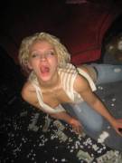 Licking her lips with her nipples out