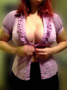 Here she is trying to button the shirt from the banner. (She knows I'm posting)