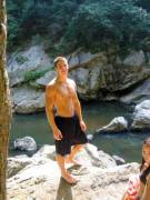 He has big male breasts.