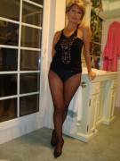 Older milf in a black fishnet pantyhose