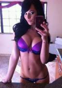 Pornstar body in purple and blue underwear.