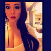 Request This Busty Brunette Cutie