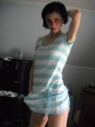 She's not even trying to hide her bulge in that blue striped dress