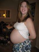 Proudly showing off her belly