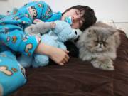 My BF sleeping with my cat and some of our plushies! &lt;3