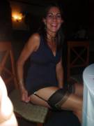 Mom is embarrassed because her skirt accidentally got caught on her chair and revealed a bit of her leg