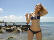 Blonde with little tits wearing a bikini that shows off her camel toe